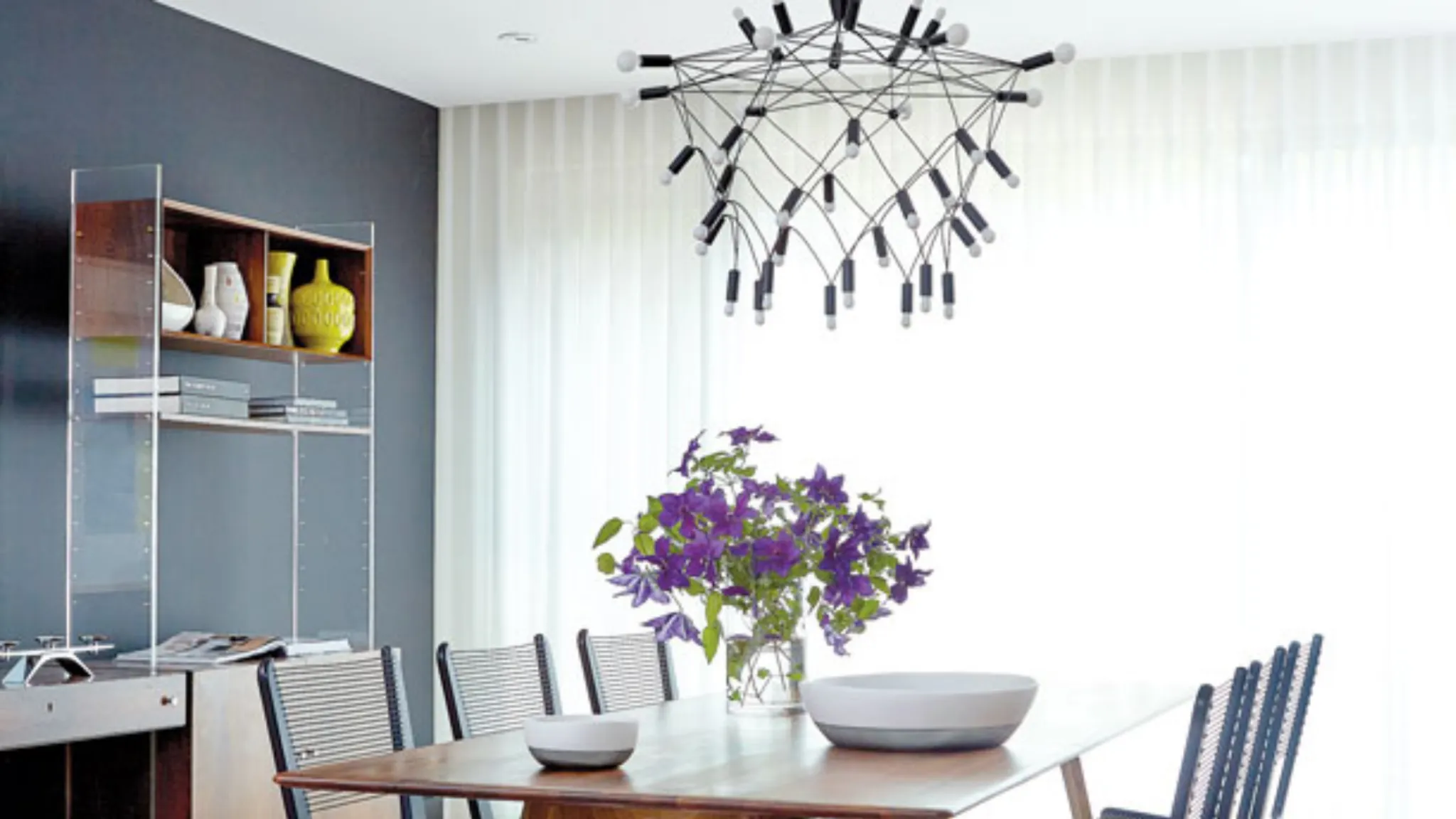 a dining room with a table and chairs